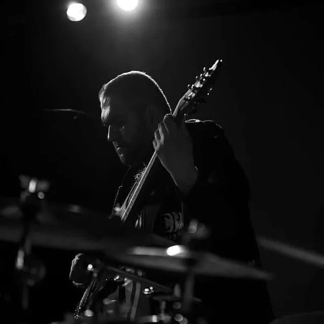 Backlit over the bass, high-contrast monochrome