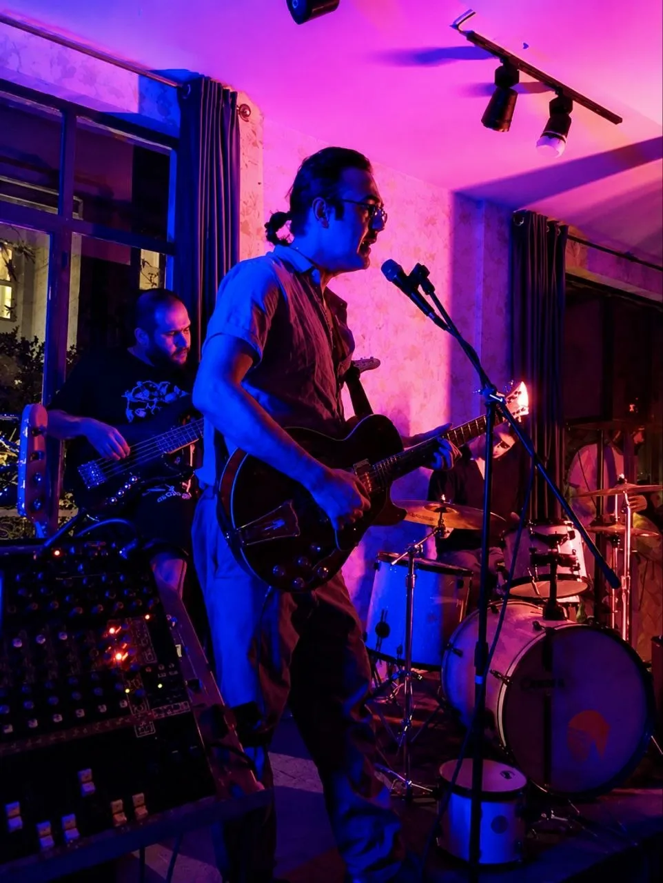 Small-venue gig in violet light